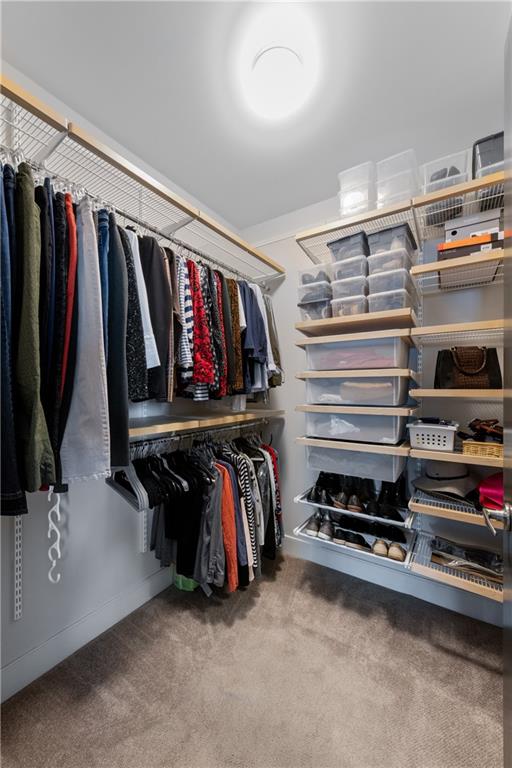 201 West Ponce De Leon Avenue, Unit 502 Decatur, GA 30030 - Photo 32 of 49 a view of walk in closet with clothes and shoes
