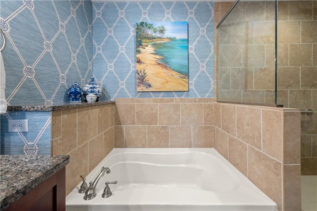 201 West Ponce De Leon Avenue, Unit 502 Decatur, GA 30030 - Photo 34 of 49 a bath tub sitting next to a sink
