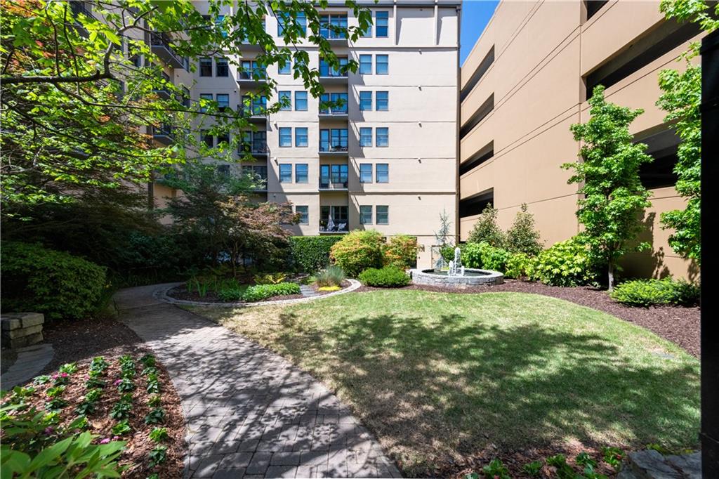 201 West Ponce De Leon Avenue, Unit 502 Decatur, GA 30030 - Photo 49 of 49 a view of a building with garden