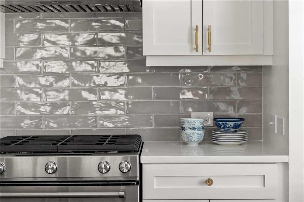201 West Ponce De Leon Avenue, Unit 502 Decatur, GA 30030 - Photo 6 of 49 a stove top oven sitting inside of a kitchen