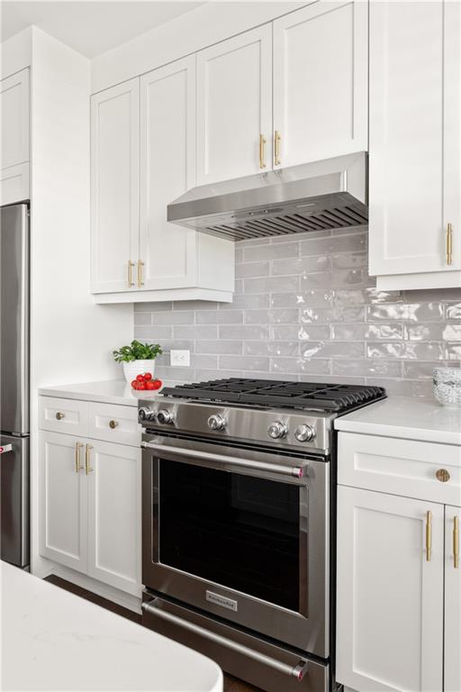 201 West Ponce De Leon Avenue, Unit 502 Decatur, GA 30030 - Photo 7 of 49 a stove top oven sitting inside of a kitchen