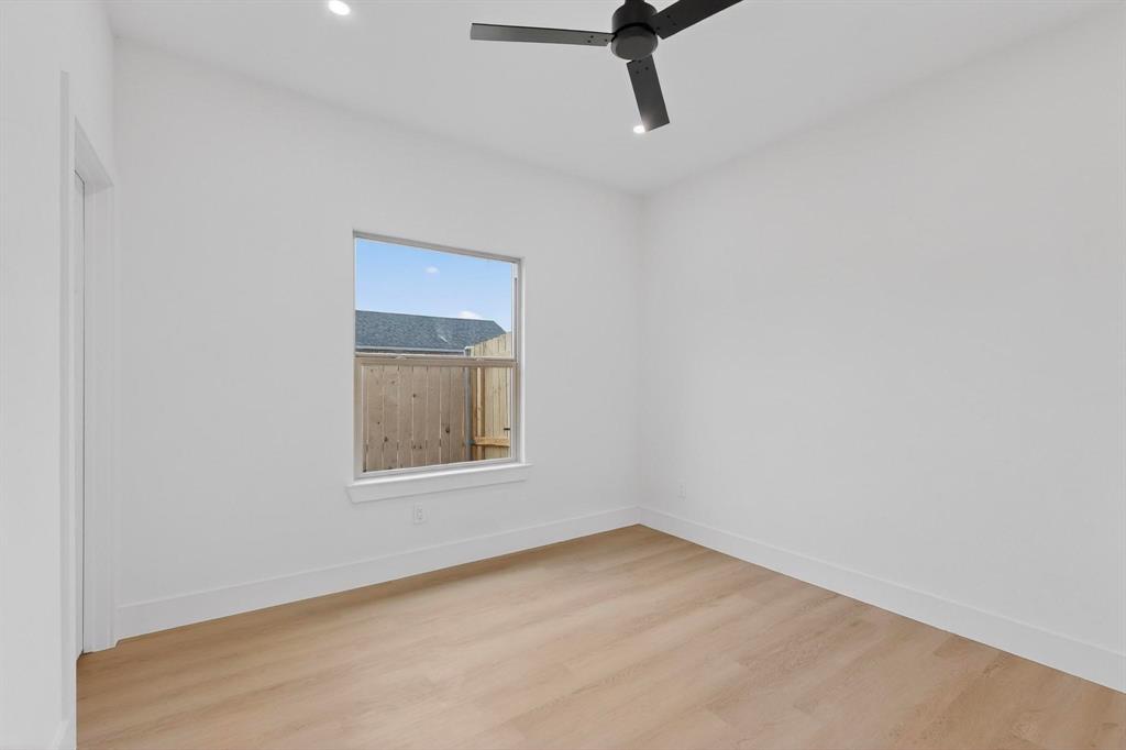 10145 Budtime Lane Dallas, TX 75217 - Photo 22 of 34 an empty room with a window