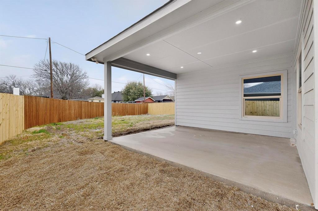 10145 Budtime Lane Dallas, TX 75217 - Photo 28 of 34 a view of backyard and tree