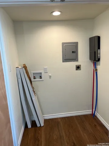 a view of a hallway with furniture