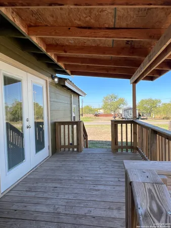 a view of outdoor space with wooden floor