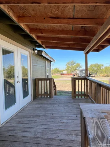 a view of outdoor space with wooden floor
