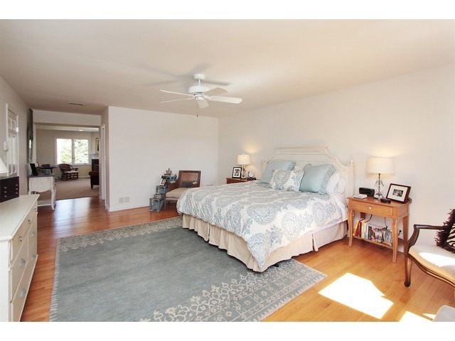 44 Farnham Road Lake Forest, IL 60045 - Photo 18 of 25 a spacious bedroom with a bed and a chandelier