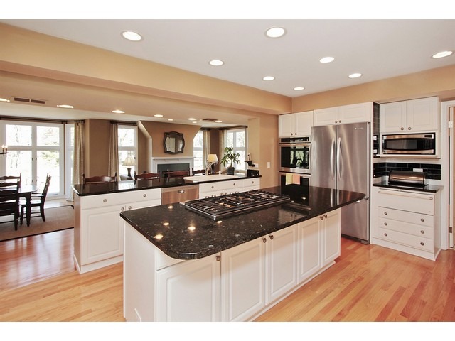 44 Farnham Road Lake Forest, IL 60045 - Photo 6 of 25 a kitchen with stainless steel appliances granite countertop a refrigerator a stove and a sink