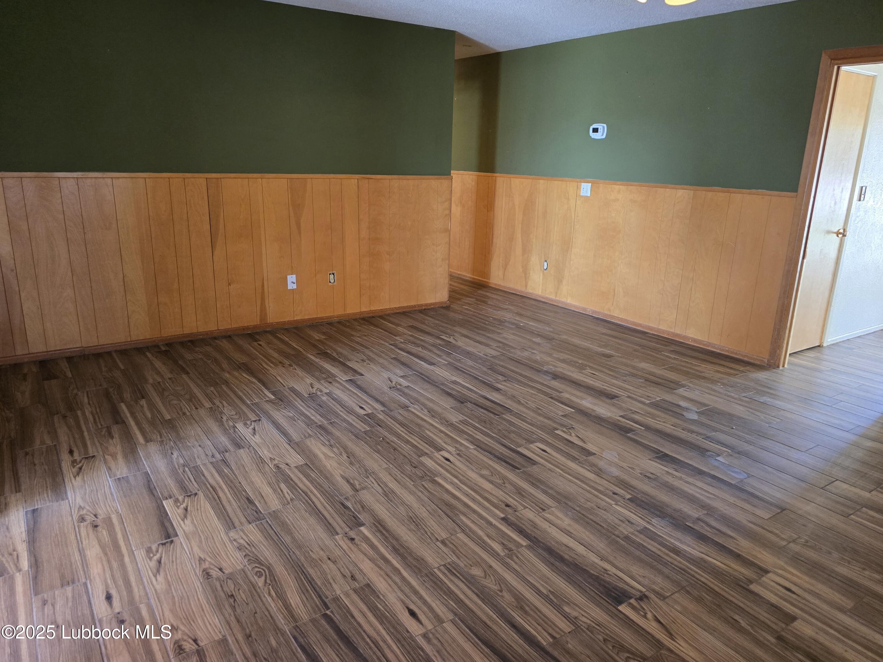 1681 Co Road Denver City, TX 79323 - Photo 11 of 30 a view of a room with wooden floor