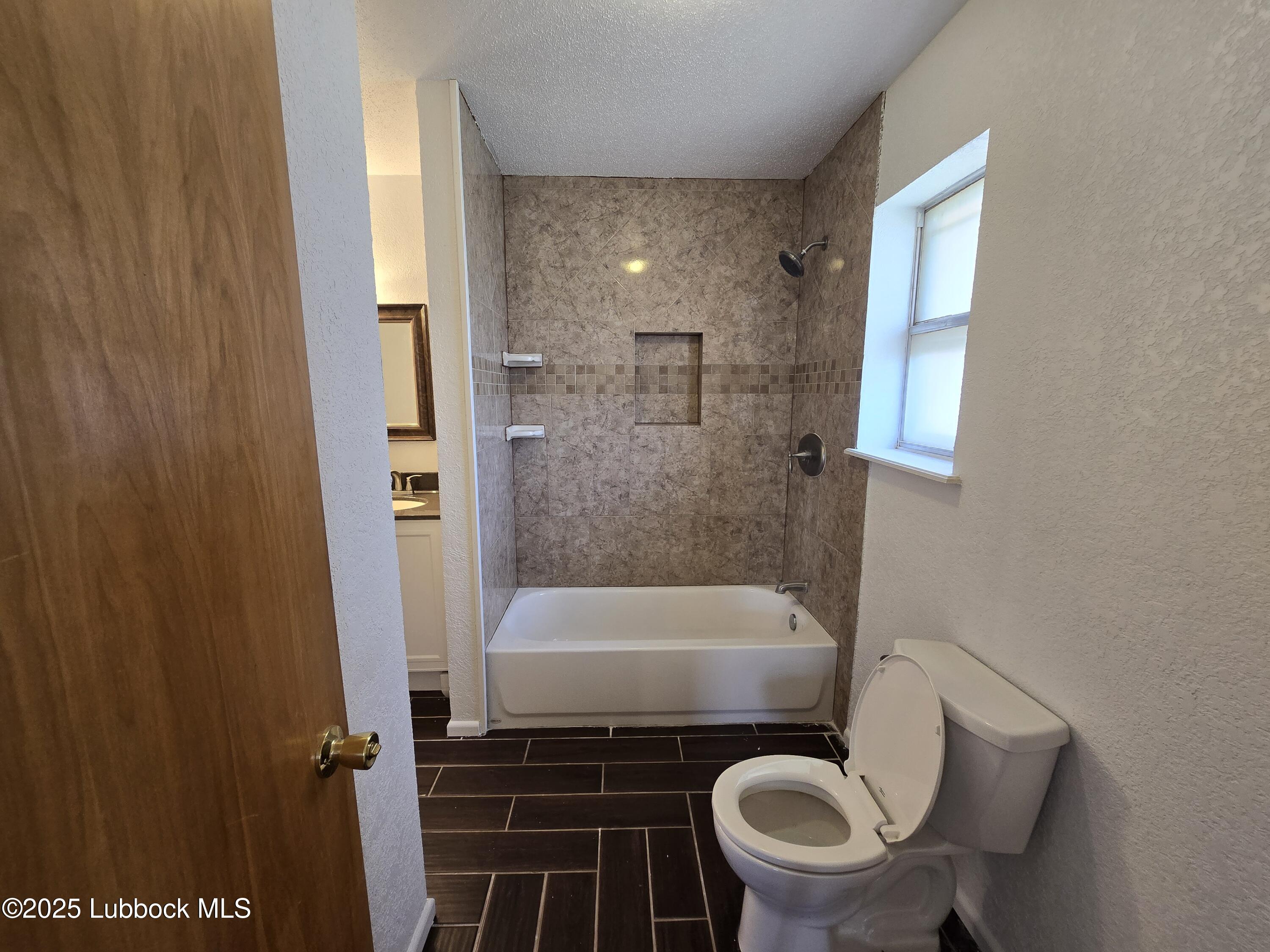 1681 Co Road Denver City, TX 79323 - Photo 16 of 30 a bathroom with a sink and toilet