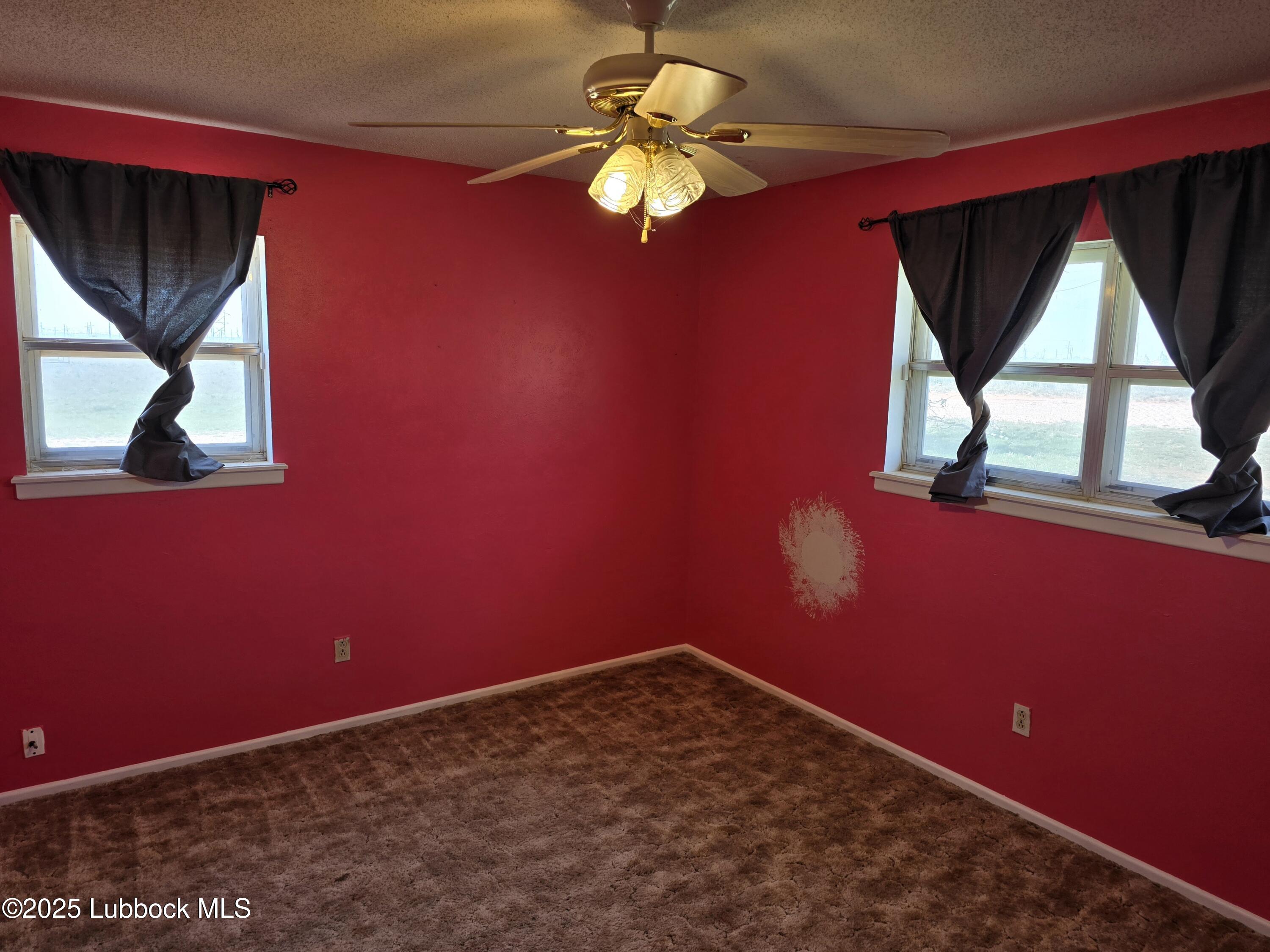 1681 Co Road Denver City, TX 79323 - Photo 19 of 30 a view of a room with a fan and a window