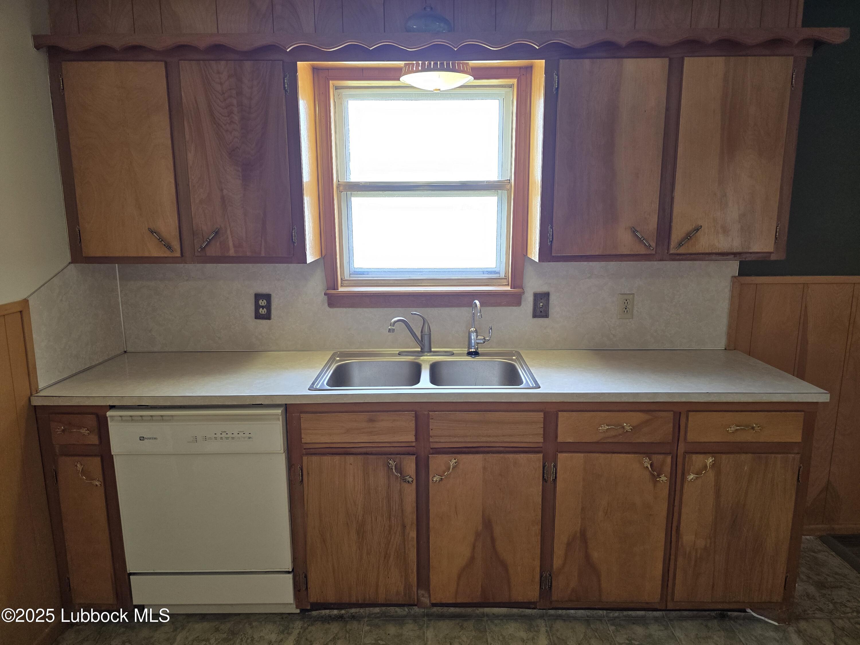 1681 Co Road Denver City, TX 79323 - Photo 7 of 30 a kitchen with a sink cabinets and window