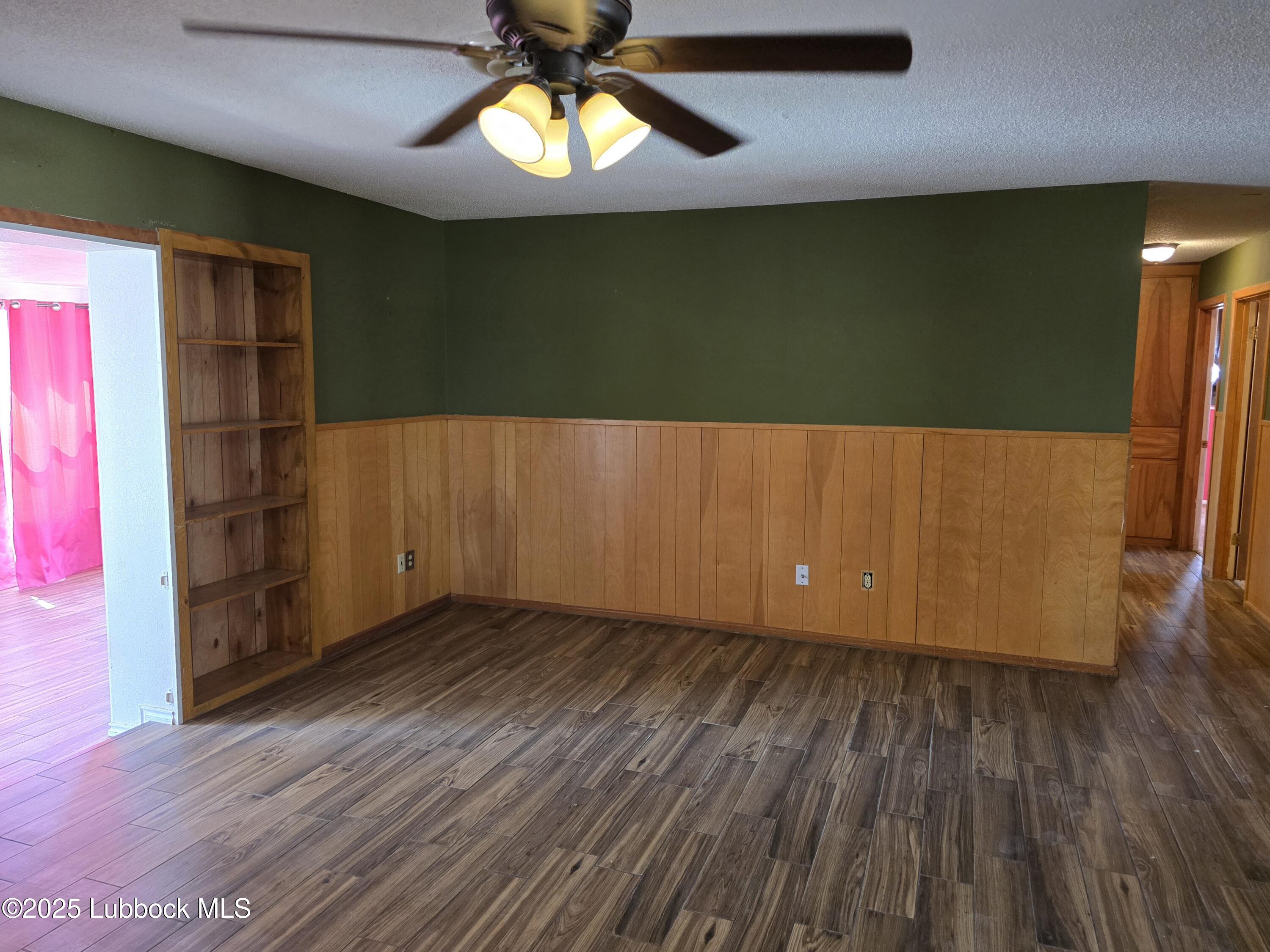 1681 Co Road Denver City, TX 79323 - Photo 10 of 30 wooden floor in an empty room