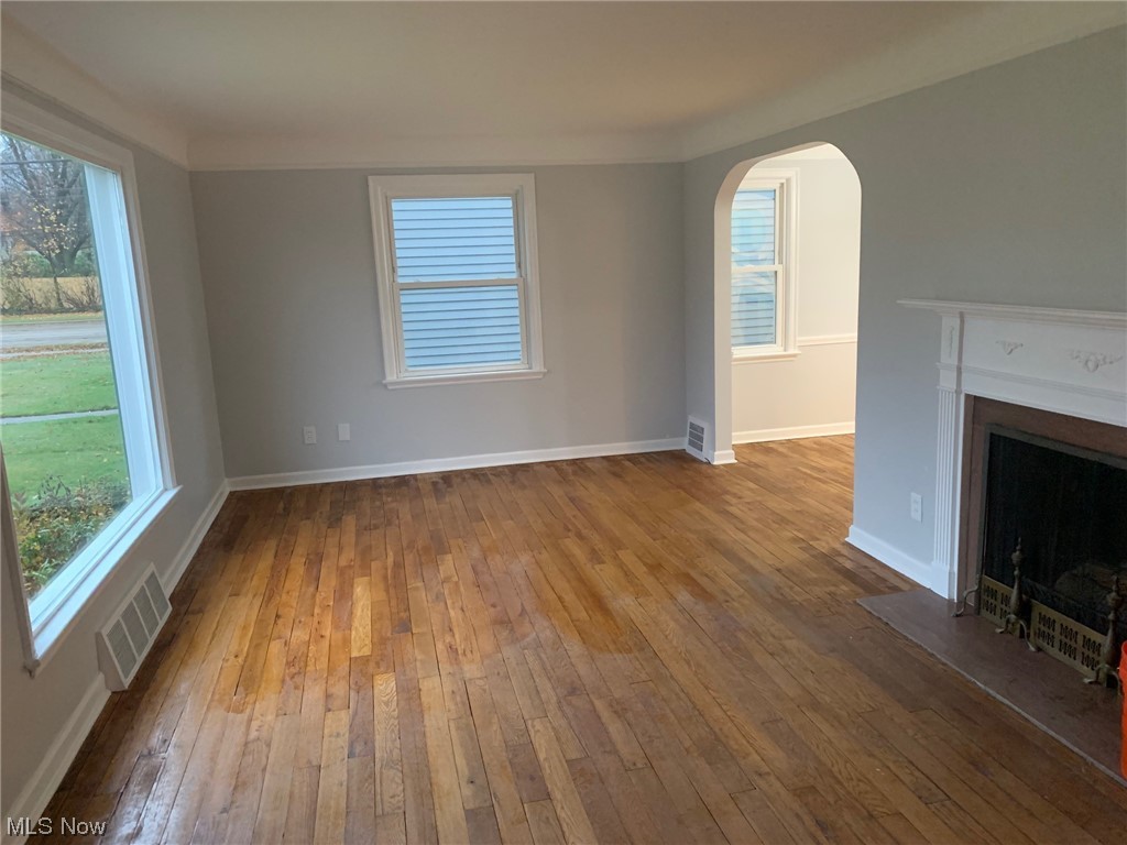 1456 Evanston Road Lyndhurst, OH 44124 - Photo 9 of 32 Unfurnished living room featuring hardwood / wood-style floors