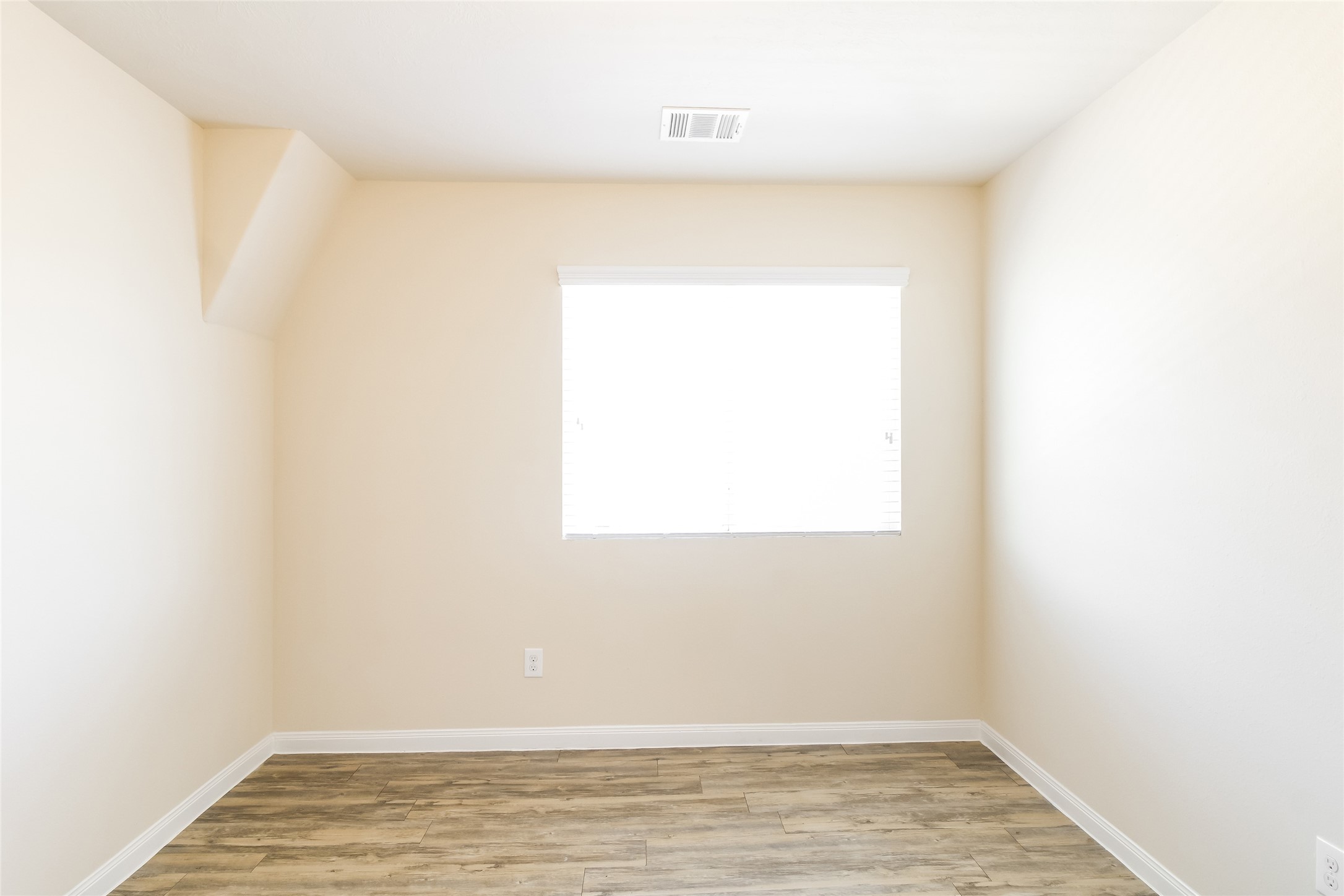 6002 Peaceful Ridge Drive Houston, TX 77048 - Photo 11 of 12 a view of a small space with wooden floor and a window