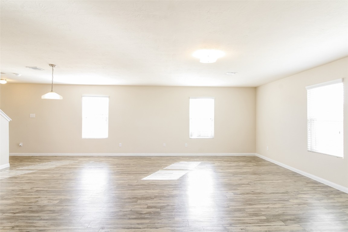 6002 Peaceful Ridge Drive Houston, TX 77048 - Photo 4 of 12 a view of an empty room and window