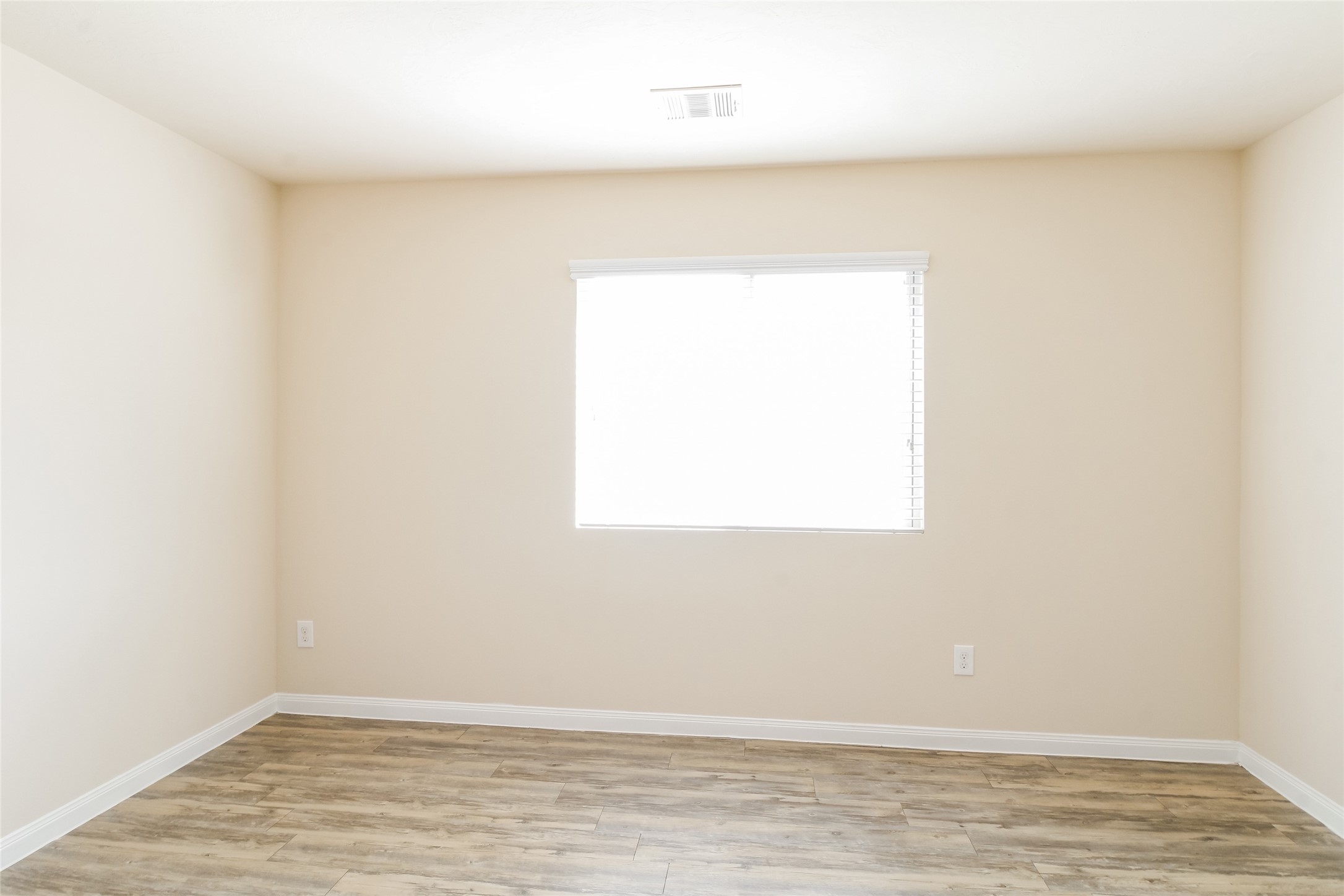 6002 Peaceful Ridge Drive Houston, TX 77048 - Photo 10 of 12 a view of a small space with wooden floor and a window