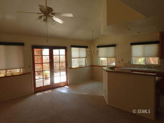 607 Plumblossom Court Ridgecrest, CA 93555 - Photo 6 of 28 a view of an empty room with a window