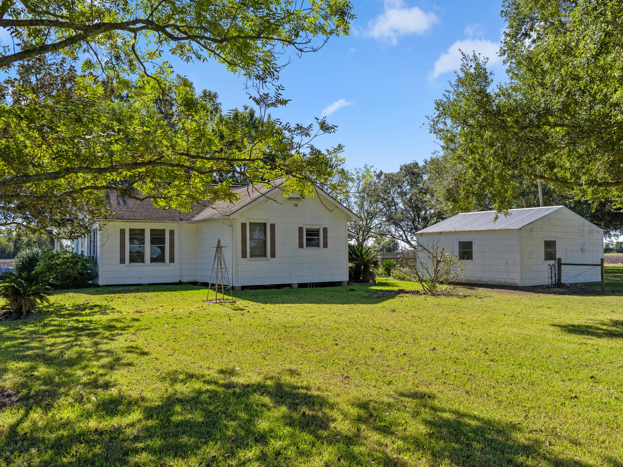 14309 Vrlla Road Guy, TX 77444 - Photo 17 of 41 a front view of house with yard and trees in the background