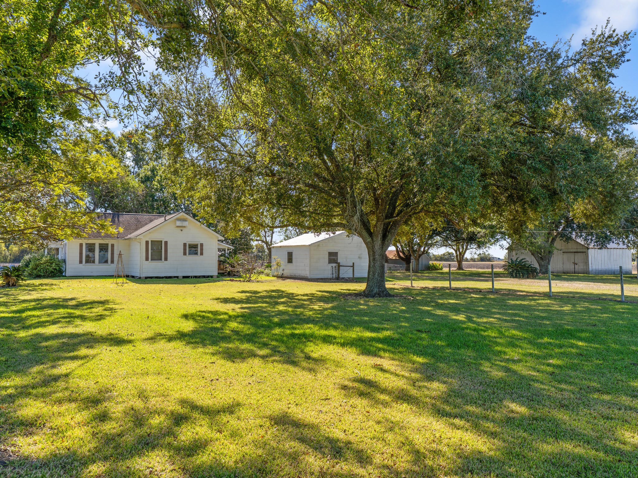 14309 Vrlla Road Guy, TX 77444 - Photo 18 of 41 a front view of house with yard and tree in it