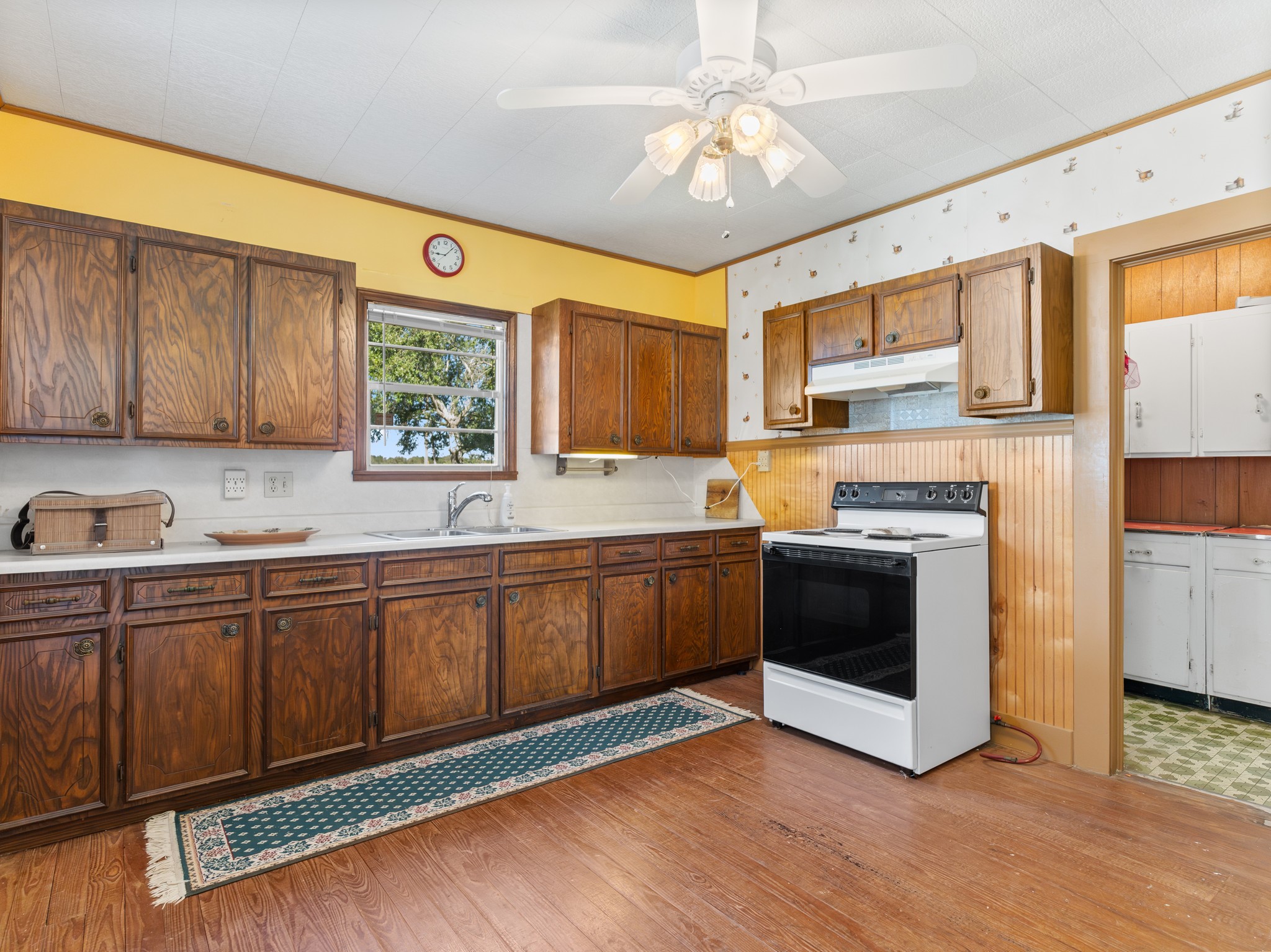 14309 Vrlla Road Guy, TX 77444 - Photo 20 of 41 a kitchen with stainless steel appliances granite countertop a stove sink and cabinets