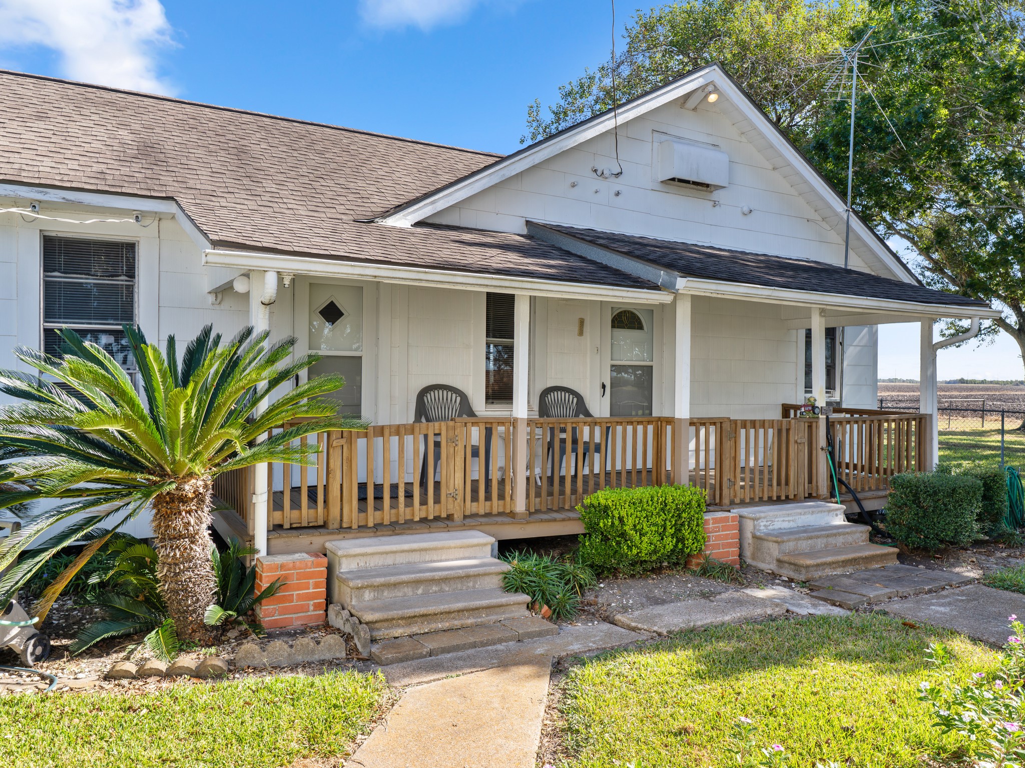 14309 Vrlla Road Guy, TX 77444 - Photo 2 of 41 a front view of a house with garden
