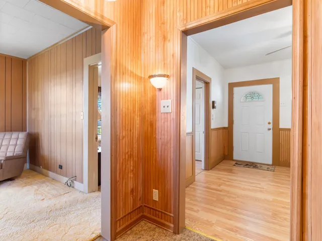 a living room with furniture toys and a large window