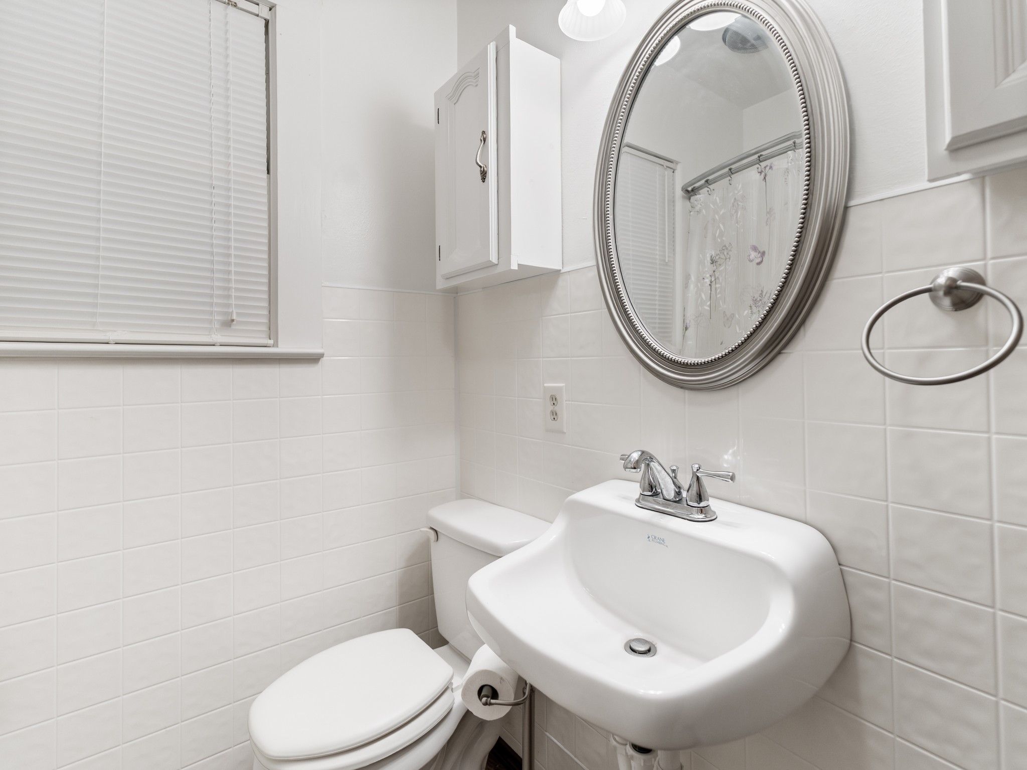 14309 Vrlla Road Guy, TX 77444 - Photo 31 of 41 a bathroom with a sink a mirror and a toilet