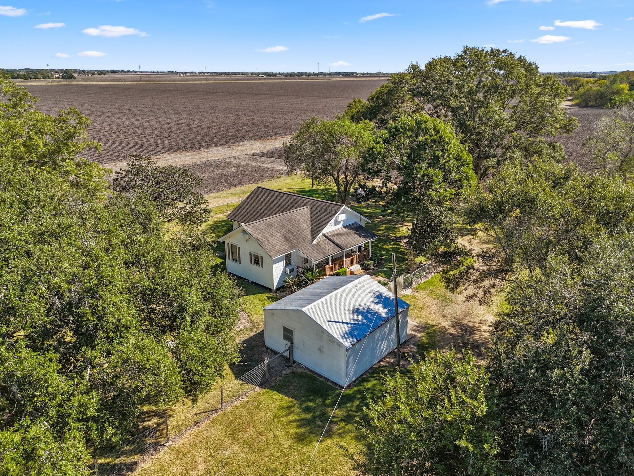 14309 Vrlla Road Guy, TX 77444 - Photo 10 of 41 a view of a lake with a house in background