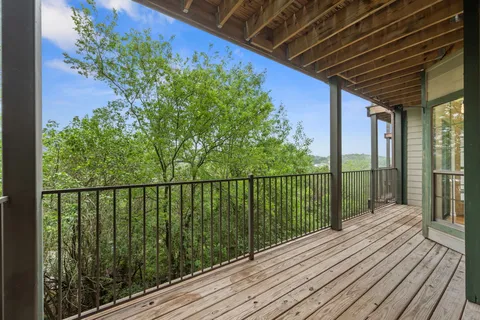 a view of balcony with wooden floor