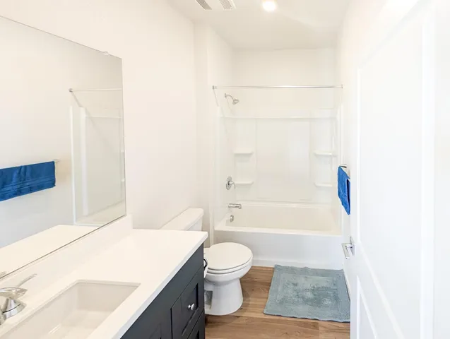 a bathroom with a toilet a sink and a bathtub
