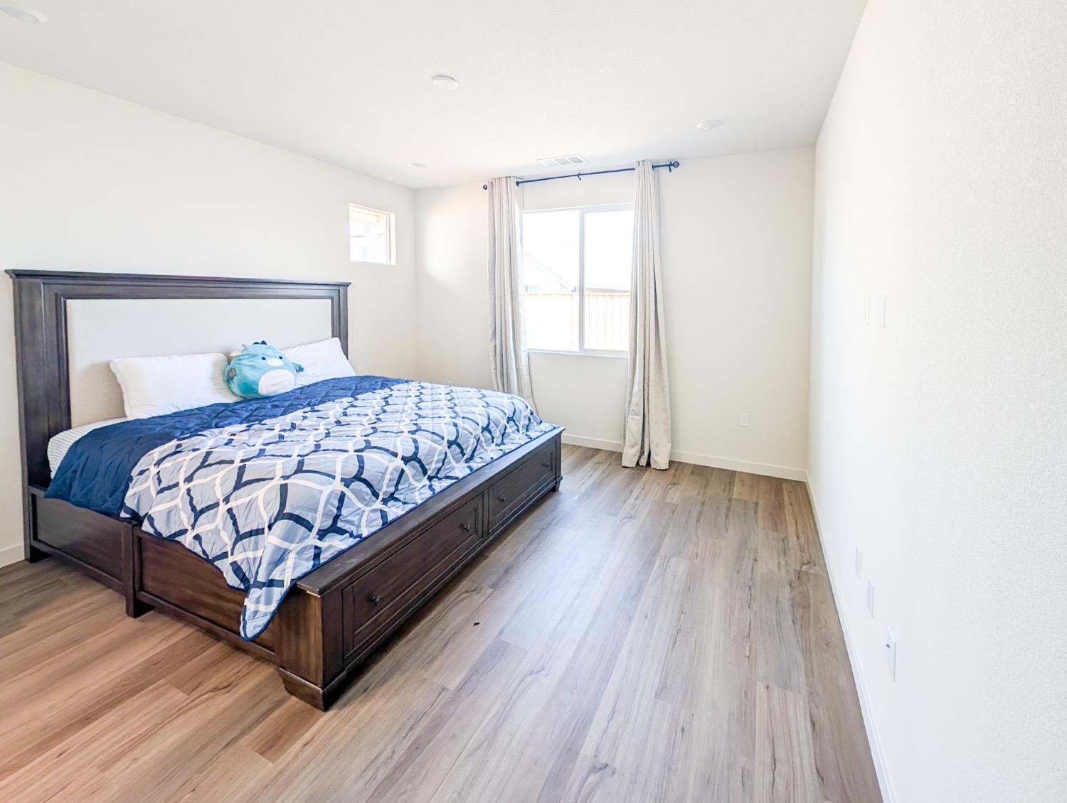 2129 Stagecoach Road Patterson, CA 95363 - Photo 16 of 23 a bedroom with a bed and a window