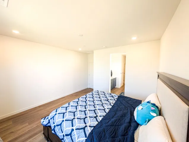 a bedroom with a bed and a table