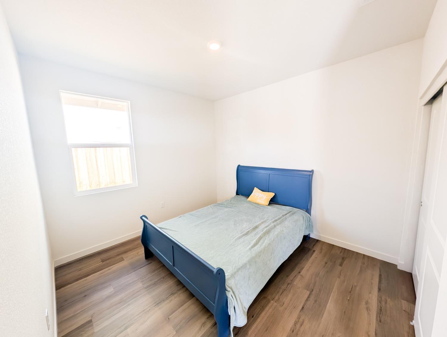 2129 Stagecoach Road Patterson, CA 95363 - Photo 6 of 23 a bedroom with a bed and window