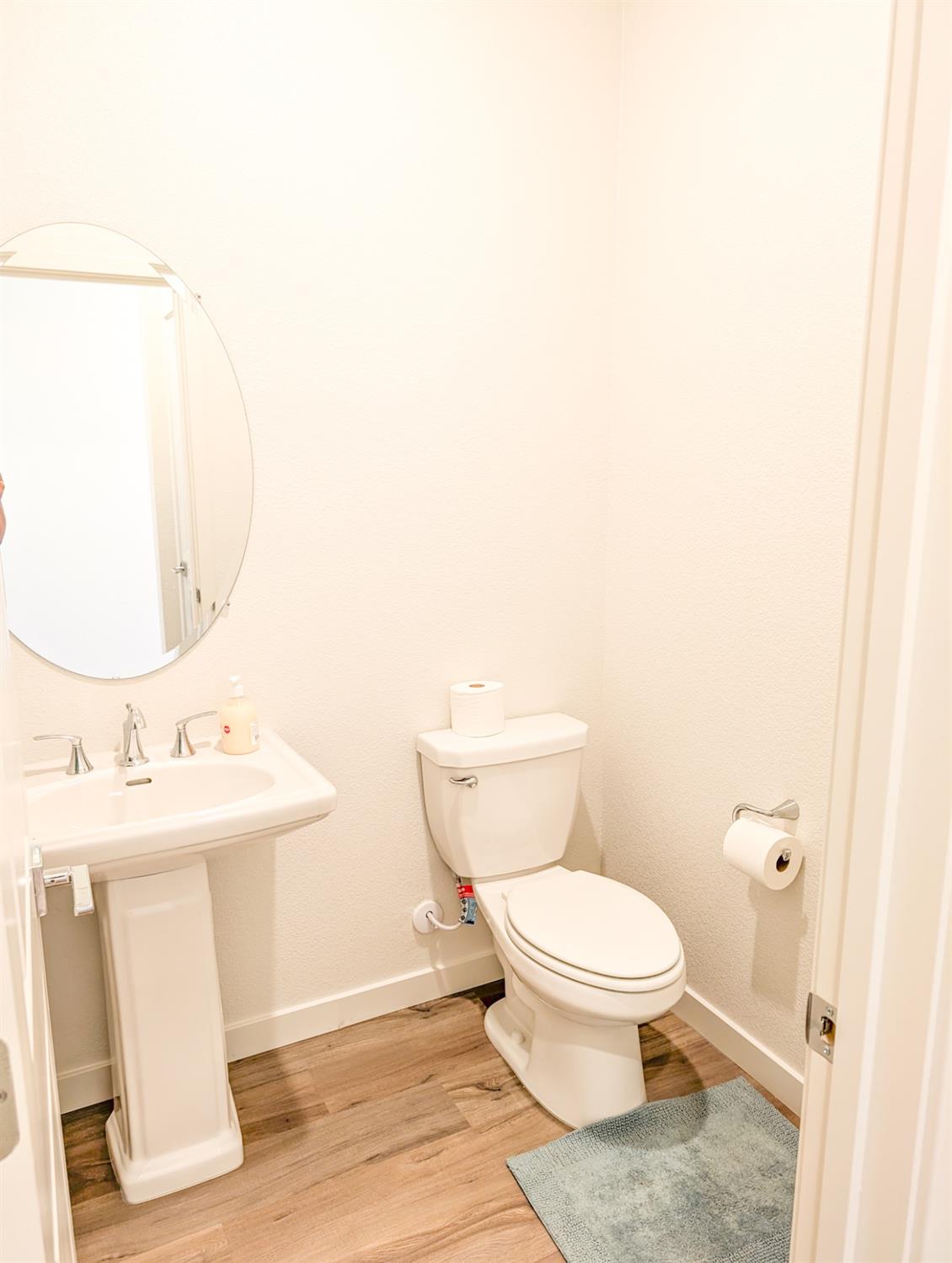 2129 Stagecoach Road Patterson, CA 95363 - Photo 8 of 23 a bathroom with a toilet a sink and mirror