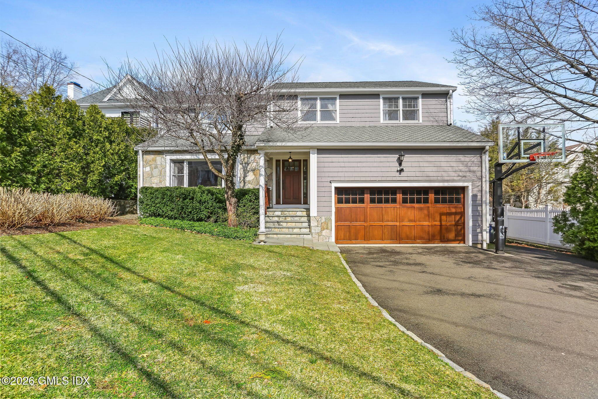 153 Lockwood Road Riverside, CT 06878 - Photo 2 of 58 a front view of a house with yard