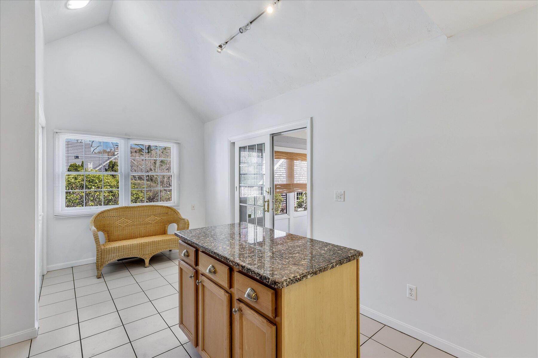 9 Red Cedar Road, Unit 9 Mashpee, MA 02649 - Photo 15 of 29 a living room with a couch and a table