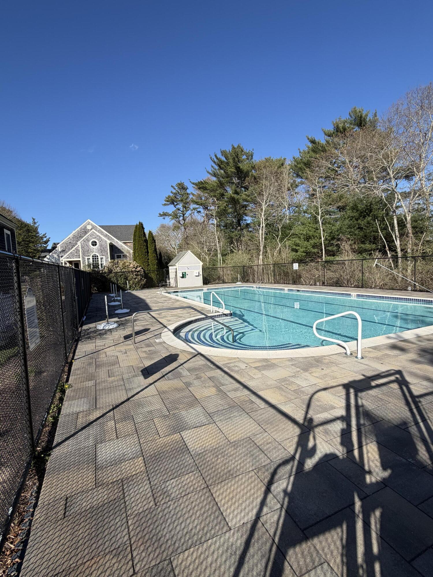 9 Red Cedar Road, Unit 9 Mashpee, MA 02649 - Photo 25 of 29 a view of a backyard with sitting area