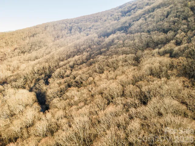 a view of mountain and an ocean