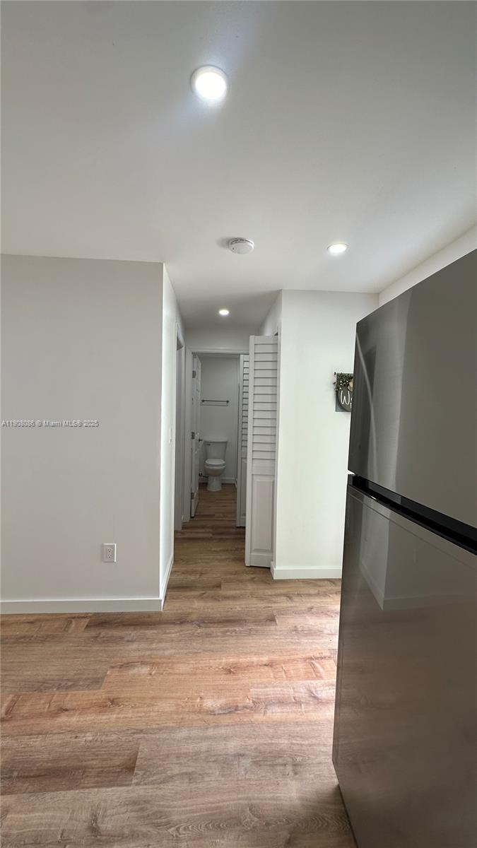 685 West 35th Street, Unit 685 Hialeah, FL 33012 - Photo 15 of 21 a view of a livingroom with wooden floor