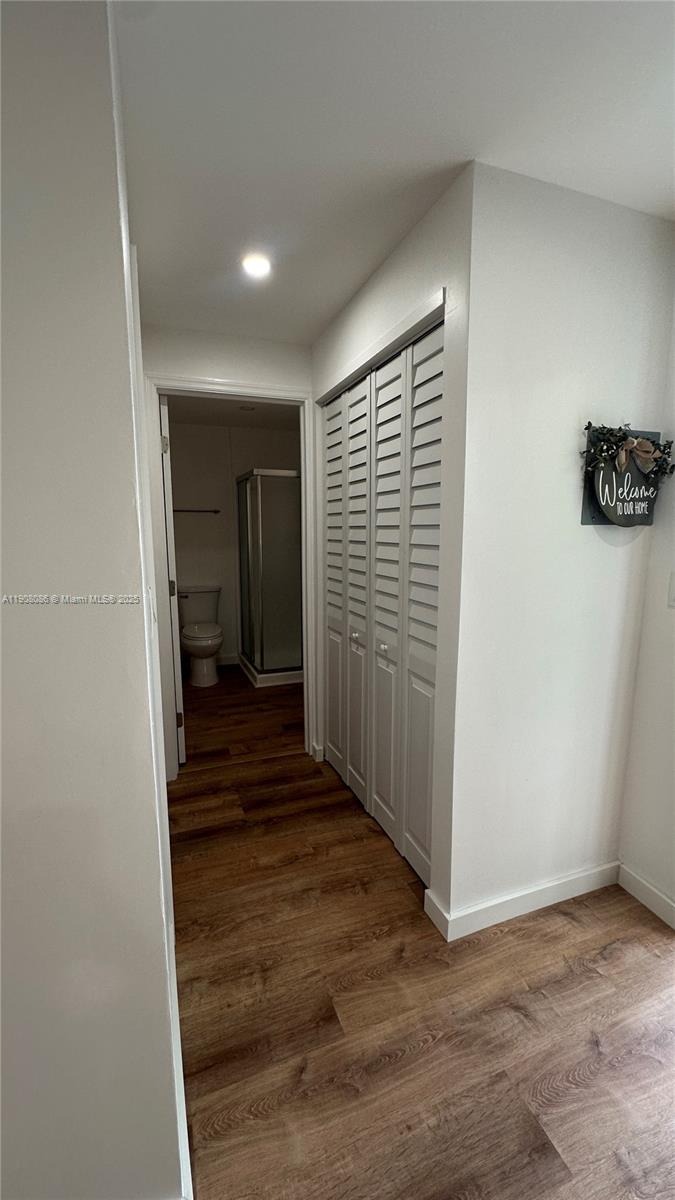 685 West 35th Street, Unit 685 Hialeah, FL 33012 - Photo 16 of 21 a view of a hallway with a chair and a refrigerator