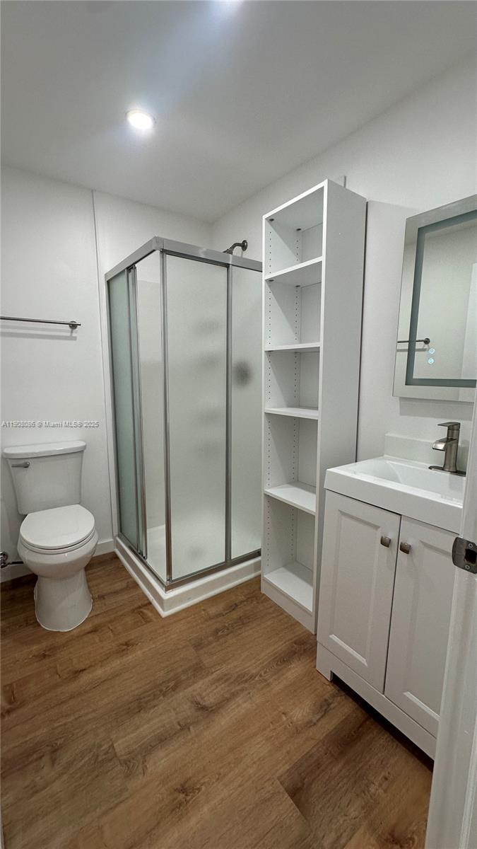 685 West 35th Street, Unit 685 Hialeah, FL 33012 - Photo 18 of 21 a bathroom with a toilet sink and a mirror