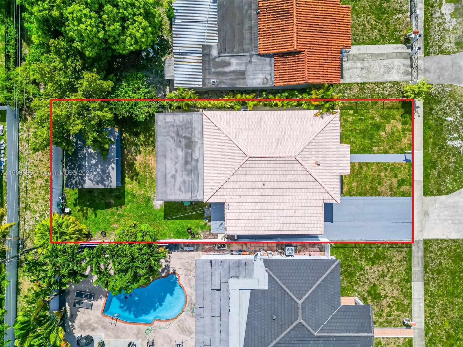 685 West 35th Street, Unit 685 Hialeah, FL 33012 - Photo 2 of 21 a aerial view of a house with a garden and plants