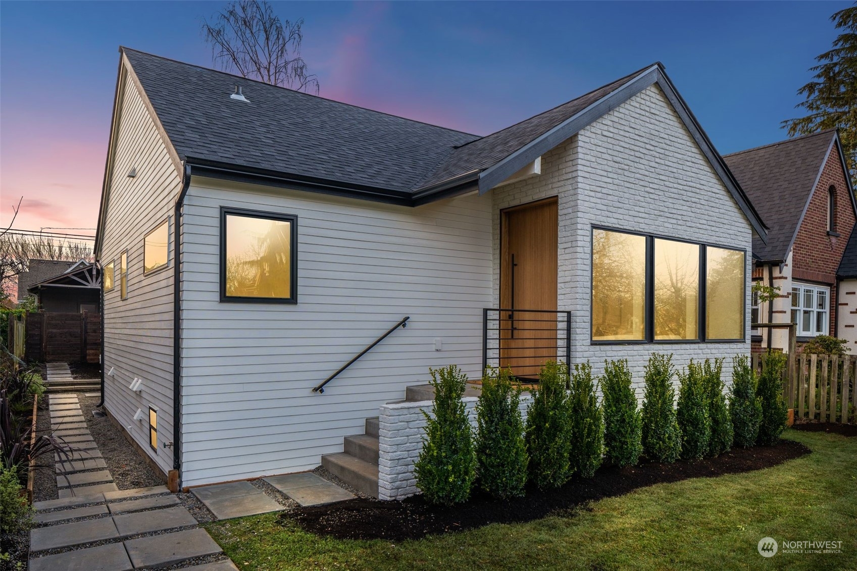 1723 45th Avenue Southwest Seattle, WA 98116 - Photo 1 of 1 a front view of a house with a yard