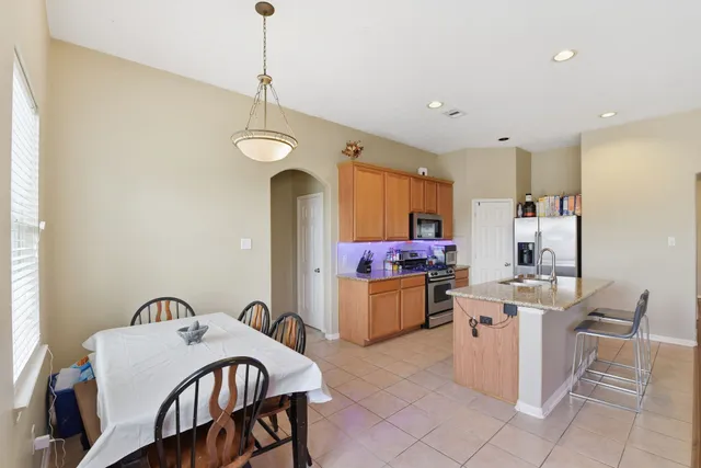 a view of a kitchen and dining room