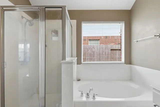 a white bath tub sitting next to a window