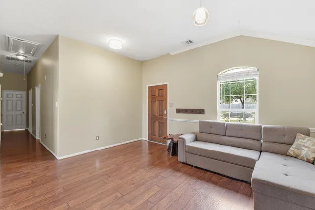 a living room with furniture and a window