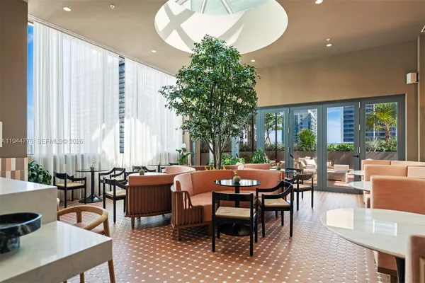 a view of a dining room with furniture window and outside view