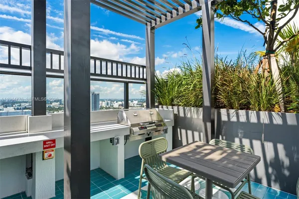 a view of a balcony with furniture