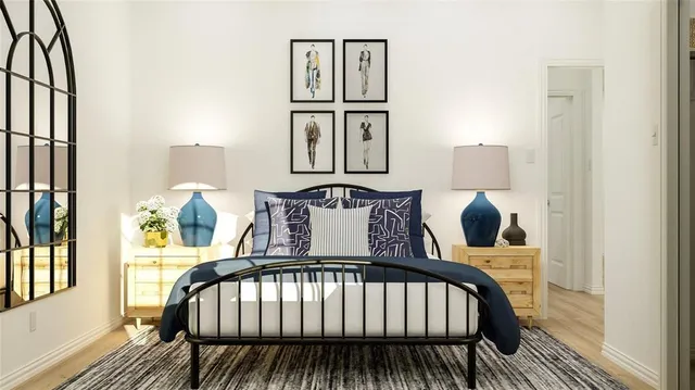 a bed sitting in a bedroom next to a window